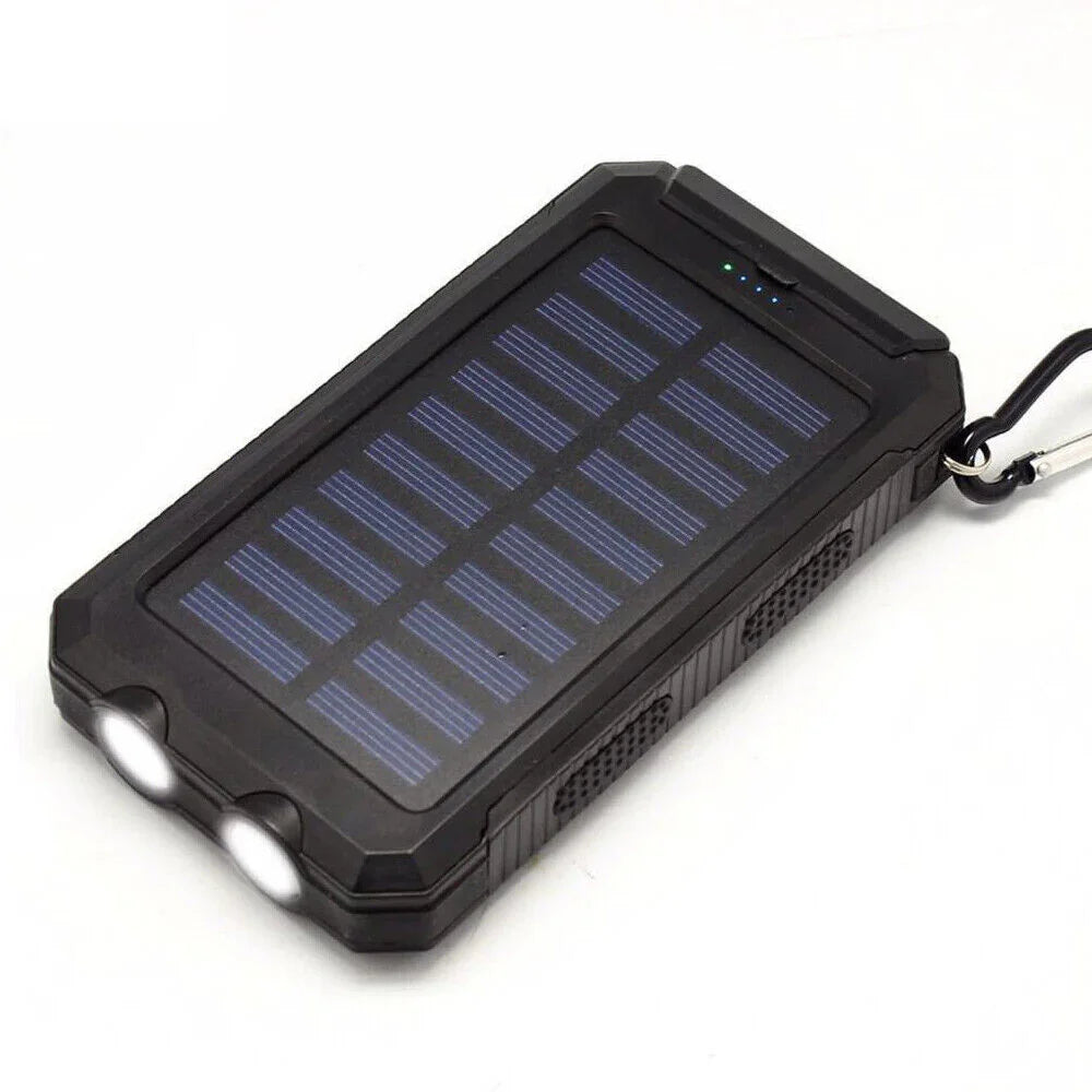 Black portable solar power bank charger with LED lights and carabiner on white background