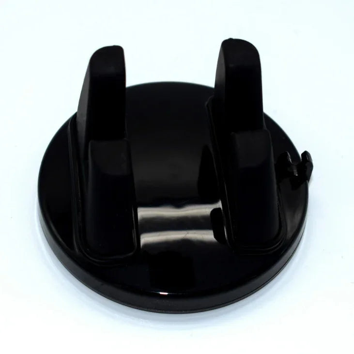 Black plastic stand with two upright slots, ideal for holding electronics or devices.