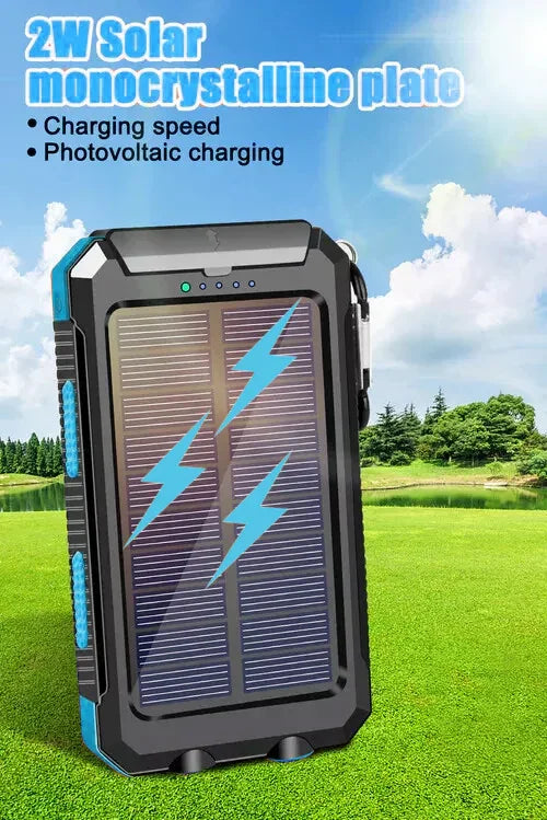 Portable solar power bank with monocrystalline panel charging outdoors on grass