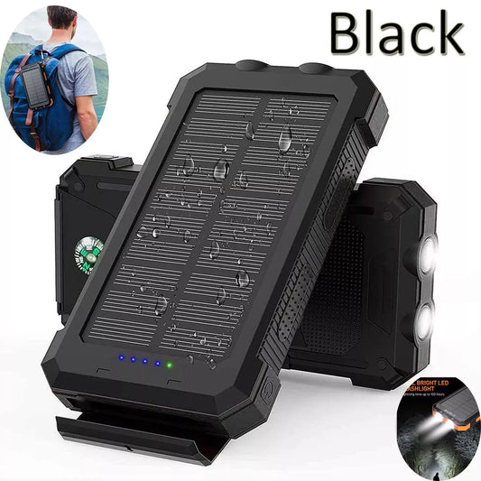 Black waterproof solar power bank with LED flashlight, compass, and USB charging, shown for outdoor use.