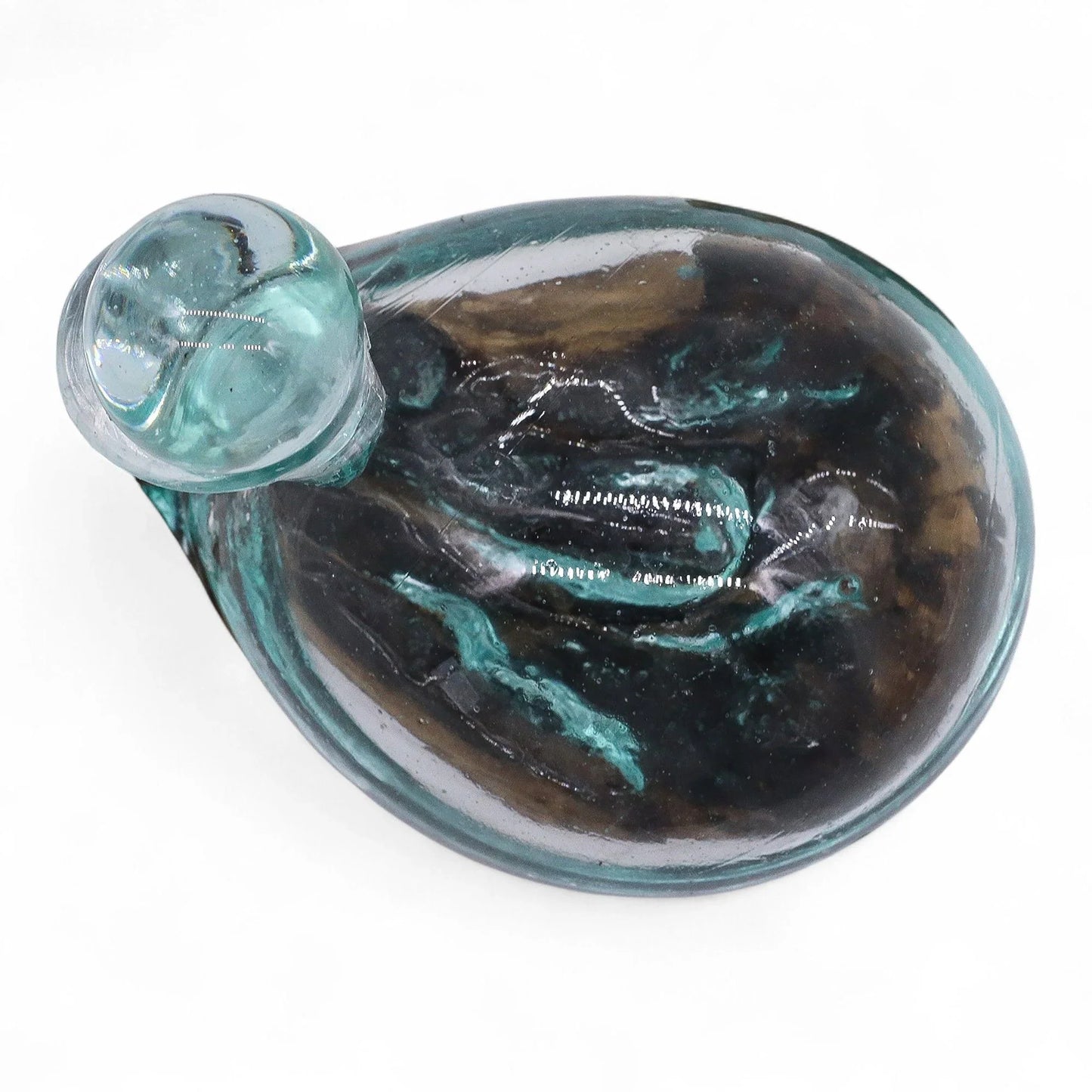 Handcrafted glass snail figurine with swirling teal and brown patterns on white background
